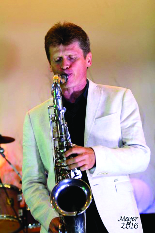 Russian saxophonist Denis Belyakov performs in Haiti